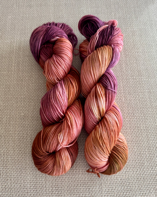 red and purple blend hand dyed sock yarn