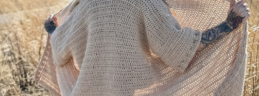 back view of an oversized crochet blanket cardigan