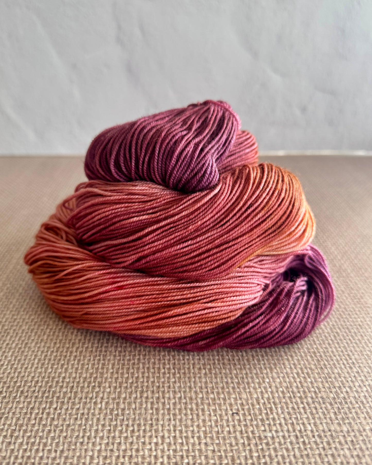 red and purple blend hand dyed sock yarn