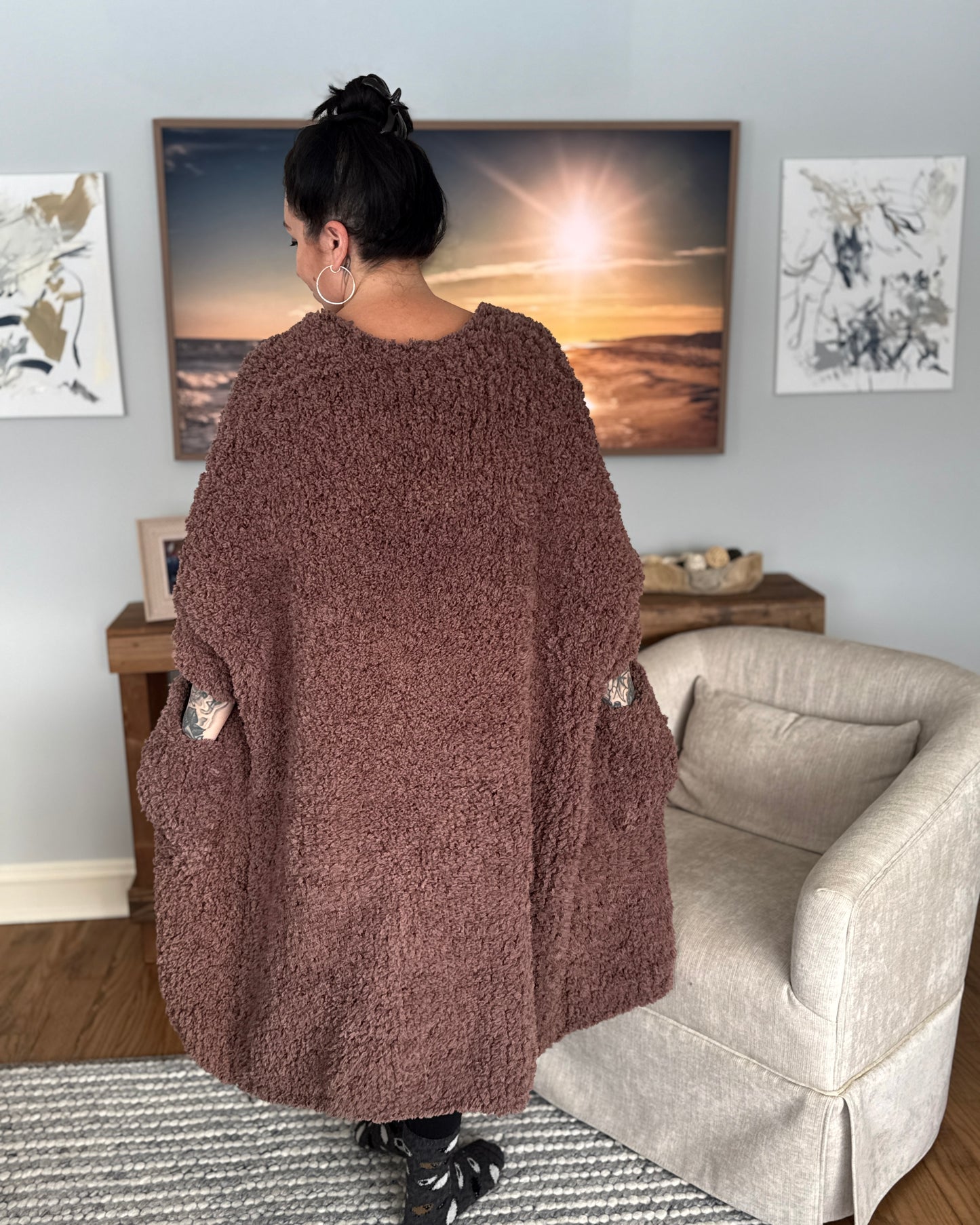 Woman facing back wearing a jumbo knit robe
