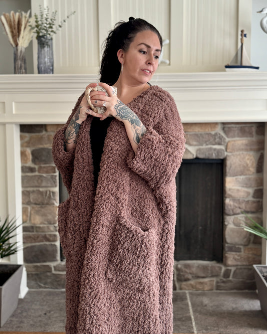 woman wearing an oversized brown knit cardigan